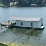 Covered floating boat dock with a single boat slip and lift on Grand Lake in Grand Lake Oklahoma