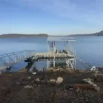 Custom lakefront dock with covered boat slip and walkway on Grand Lake in Grand Lake Oklahoma